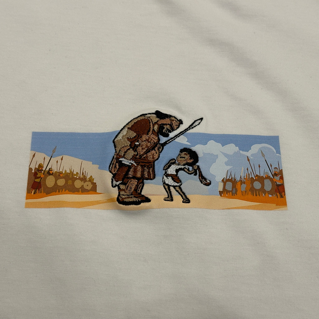 OVERSIZED Embroidered T-shirt featuring David and Goliath design with detailed embroidery and vibrant colors.